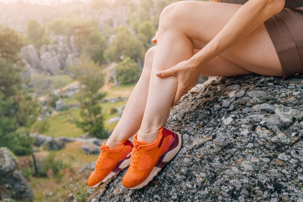 A woman's legs on a hike.